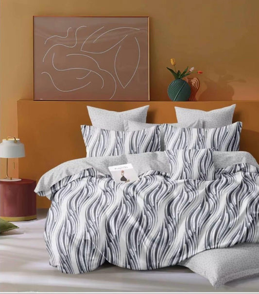 Višebojne pamučne posteljine. Sadrži: plahta 220x240 cm, navlaka za jorgan 200x220 cm, jastučnice 50x70 cm 2 komada.